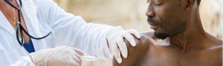 Doctor administering a vaccine